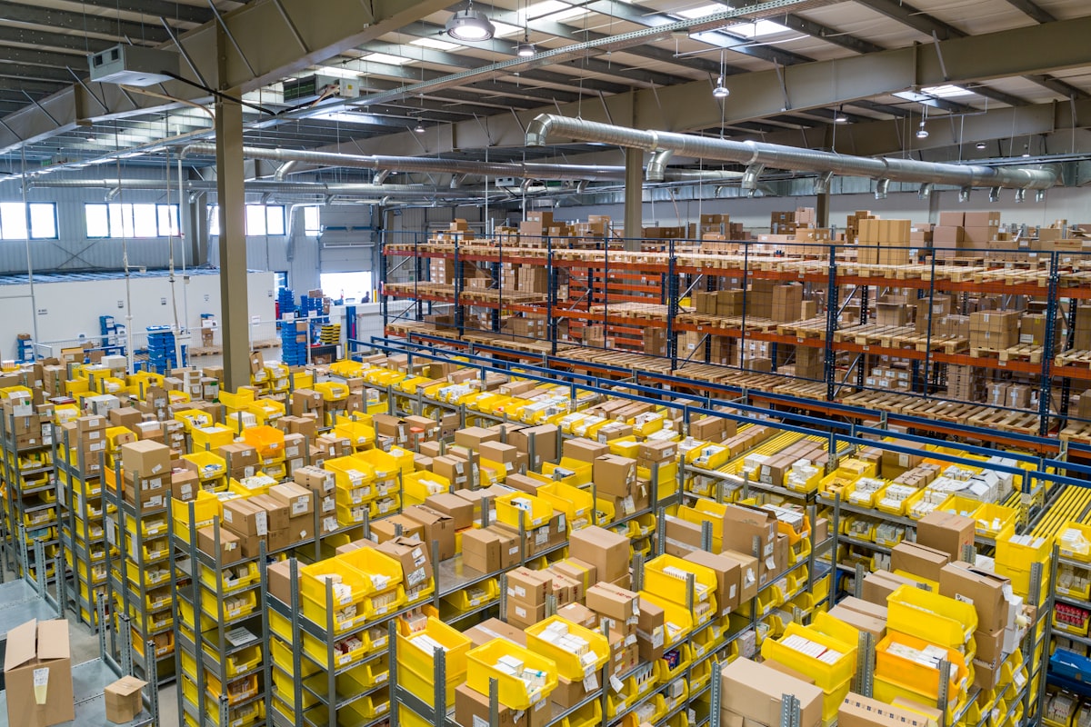 Logistics worker preparing cartons for shipment