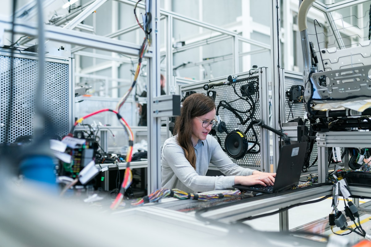 Quality engineer inspecting production inside a partner factory